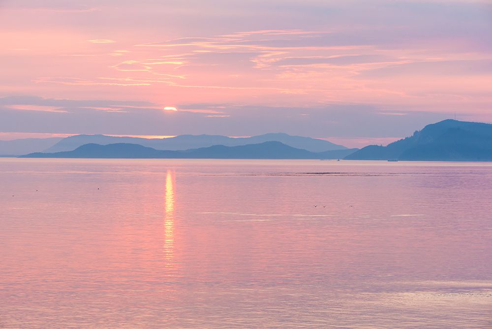 USA, San Juan Islands, Washington Reflected sunset sky from Sucia Island view to Strait of Georgia.